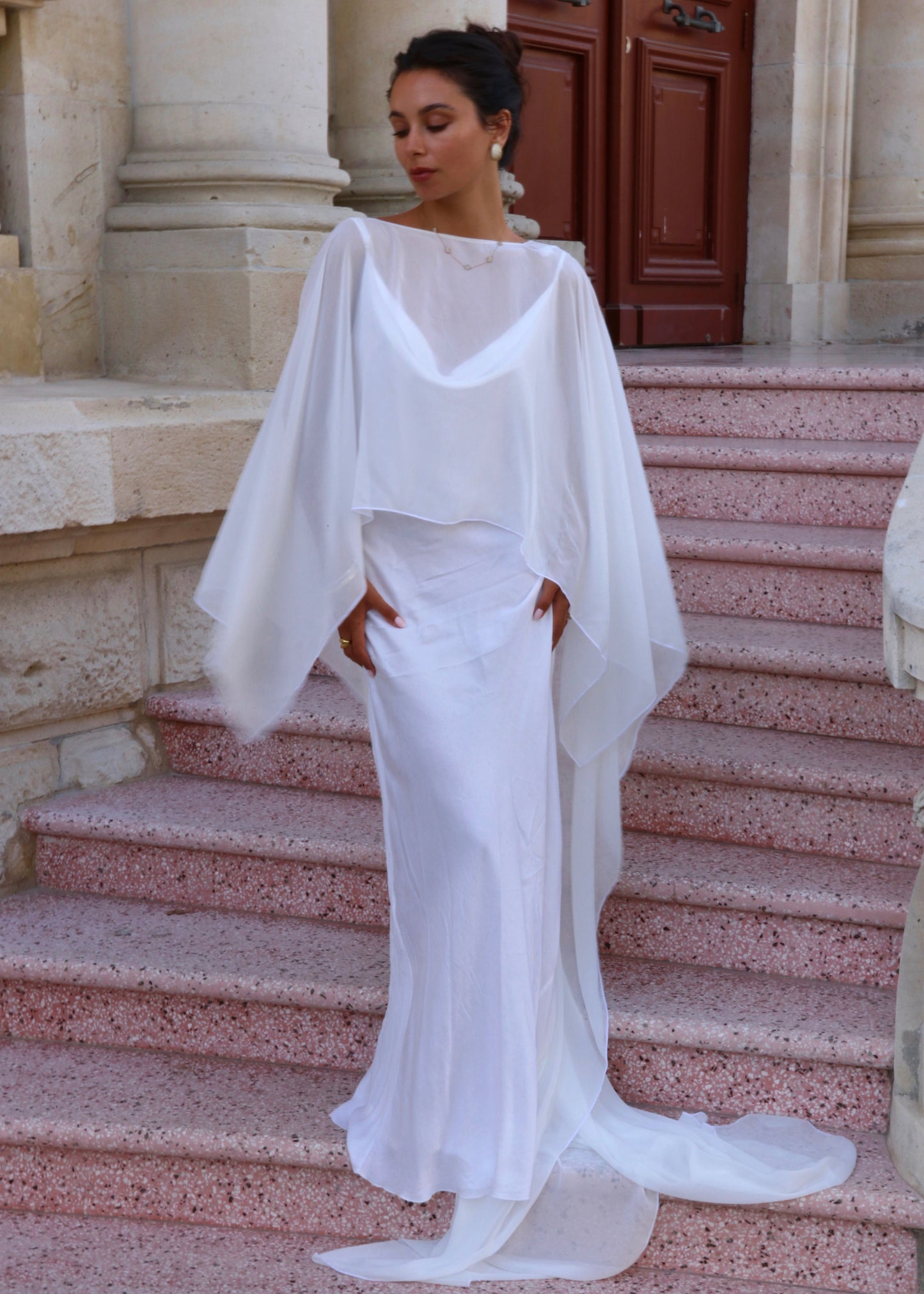 women wearing white bridal cape front