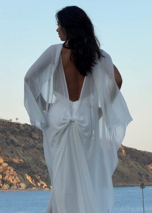 Women wearing white bridal cape